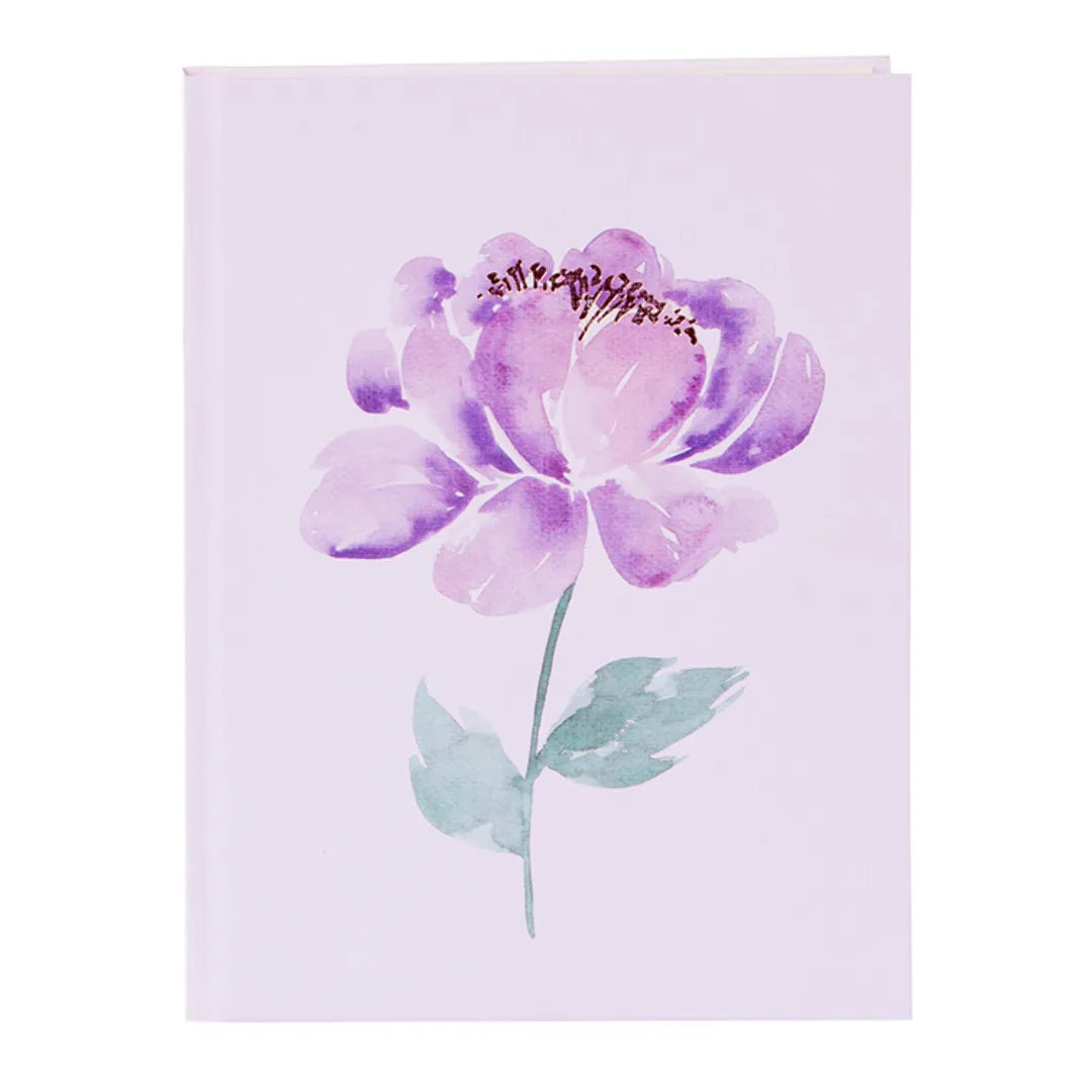 Violettes A5 Notizbuch Hardcover mit floralem Motiv und Goldprägung auf der Vorderseite.