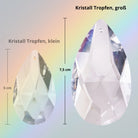 Großer Sonnenfänger Kristall in Tropfenform (7,5cm), im Größenvergleich mit kleinerem Tropfen, für magische Lichtspiele und Regenbögen.